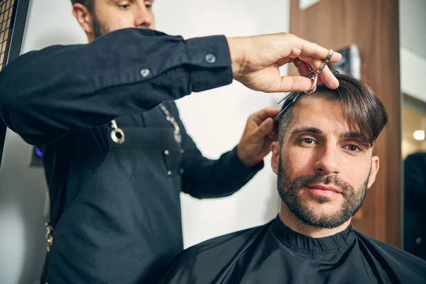 Portrait of delighted man being covered with cape — Stock Photo, Image