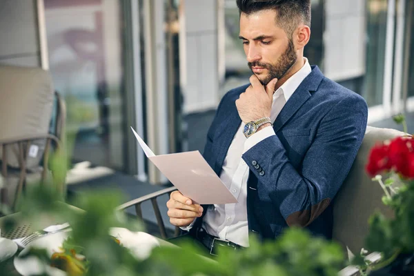 Kind bearded man being deep in his thoughts — Stock Photo, Image