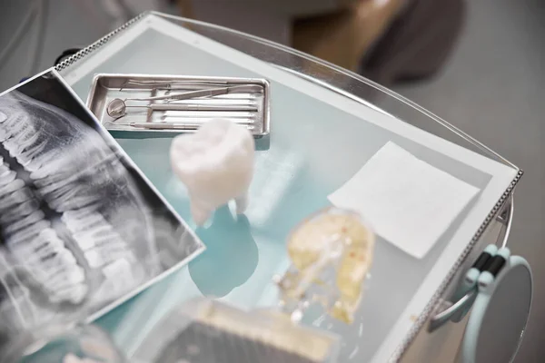 Dentists table with tools and props on it — Stock Photo, Image