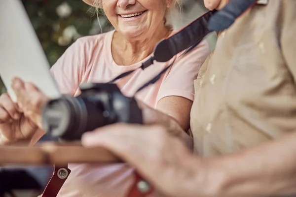 Modern elderly Caucasian couple using their gadgets — Stock Photo, Image