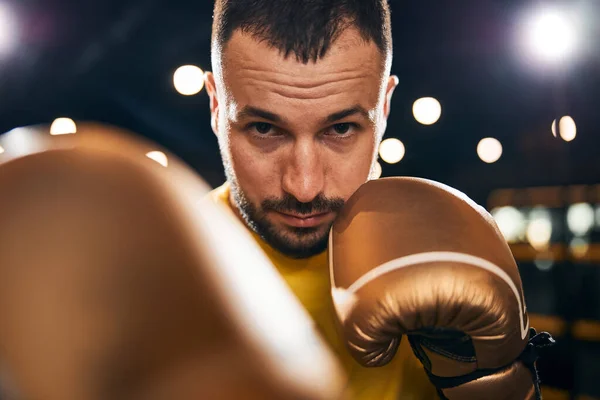 Determined sportsman hitting someone with a well-placed strike — Stock Photo, Image