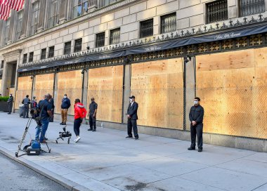 NEW YORK CITY CIRCA MAY 2020. Retailers in NYC already strained by COVID-19 shutdowns, board up storefronts for protection from violent protests, riots and looting resulting from George Floyds death  clipart