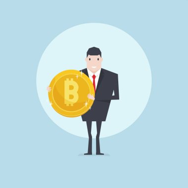 Bir altın bitcoin para tutan işadamı.
