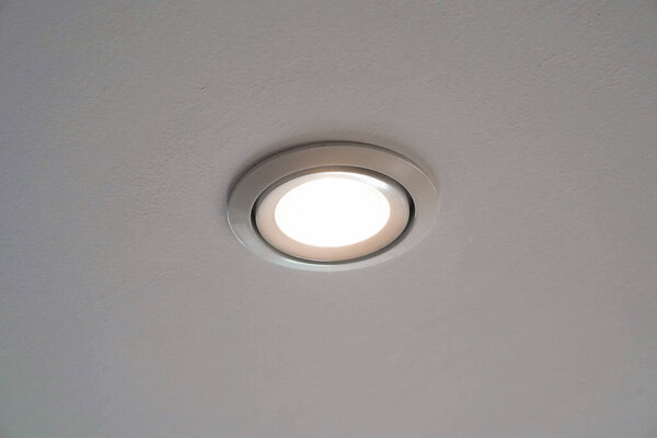 LED downlight or ceiling light Installed on a gray ceiling close up.