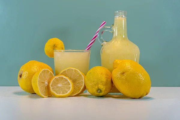 Lemon juice and fruit. Sicilian lemon (Citrus limon). Refreshing drink. Source of vitamin C. Drink of acid fruits. The lemon is a yellow and sour fruit that grows in trees or shrubs.