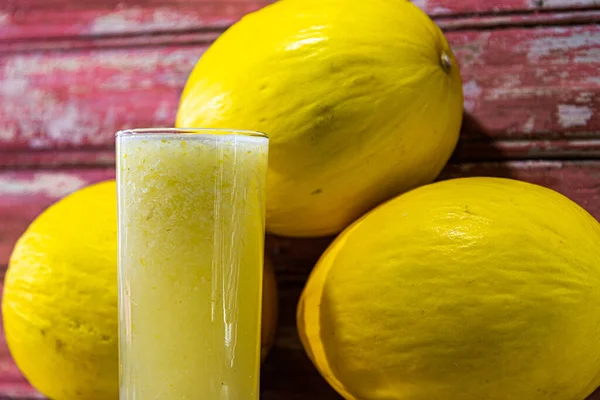 Spanish melon juice. Yellow tropical fruit. Refreshing drink. Natural fruit drink. Melon is a low calorie fruit, quite nutritionally rich and that can be used to lose weight.