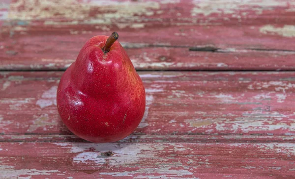 Red pear fruit (Pyrus L.). Fresh fruit. Ingredient for salads. Natural and organic food. Detox diet.