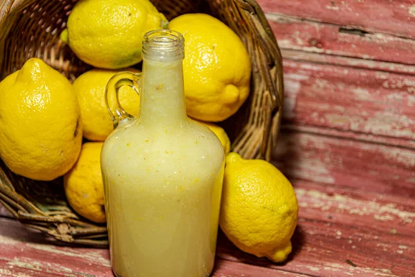 Lemon juice and fruits in wooden basket. Lemon juice is the best facilitator to reduce weight as the high content of pectin fiber in this juice benefits the body by fighting hunger cravings.