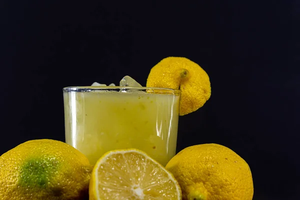 Fruits and lemon juice. Lemon or yellow lemon is a fruit that belongs to the Citrus limon family. This lemon has a thick yellow peel, juicy flesh and an acid content of around 5%.