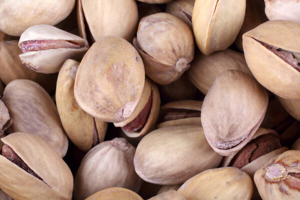 close up of a heap of salted pistachio nuts