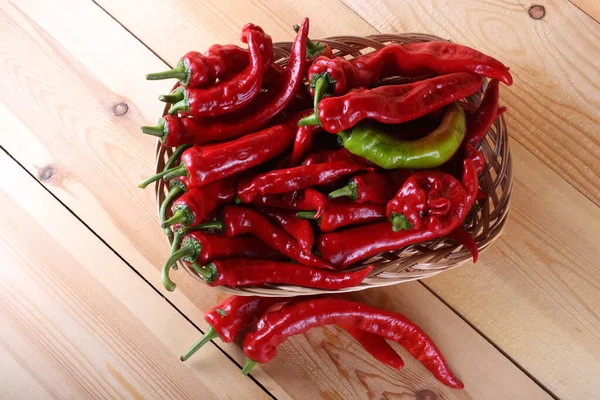 Red hot peppers on table