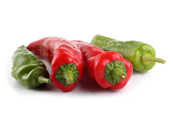 Red and green peppers isolated on white