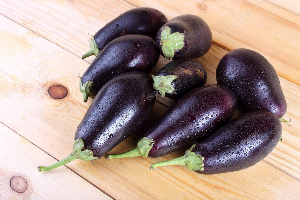 Aubergines on table. Country style