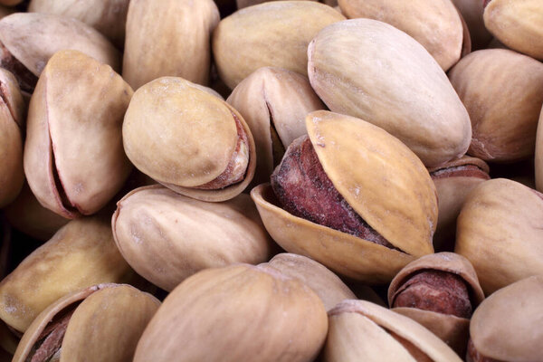 close up of a heap of salted pistachio nuts