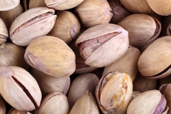 close up of a heap of salted pistachio nuts