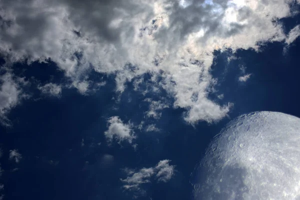 Moon and clouds on sky
