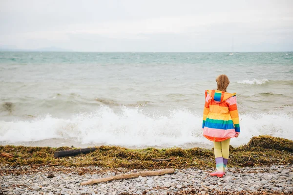 Cute Little Girl Playing Lake Windy Day Wearing Colorful Parka — Stock Photo, Image