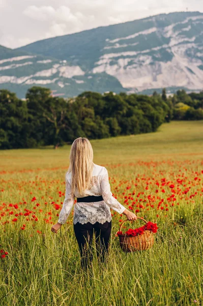 Young Blond Woman Walking Away Poppy Field Holding Basket Red — Stock Photo, Image