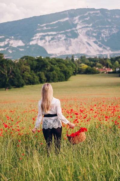 Young Blond Woman Walking Away Poppy Field Holding Basket Red — Stock Photo, Image