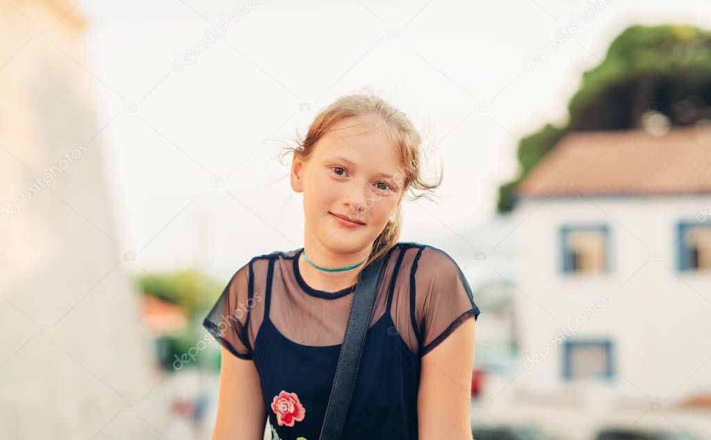 Outdoor portrait of beautiful young girl on summer vacation