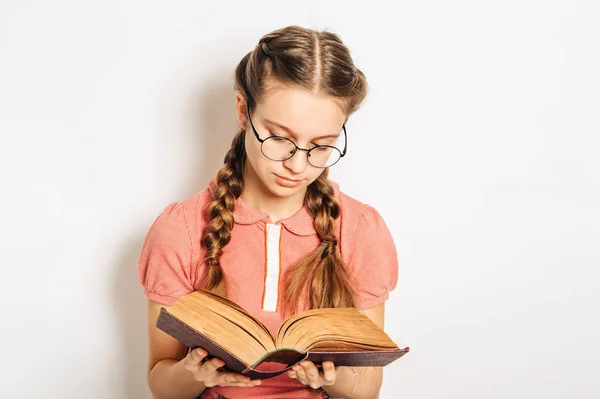 Studio Portrait Cute Preteen Girl Two Braids Holding Heavy Book — Stock Photo, Image