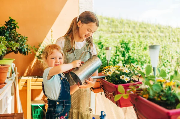 Group Two Children Watering Flowers Balcony Young Girl Help Small — Stock Photo, Image