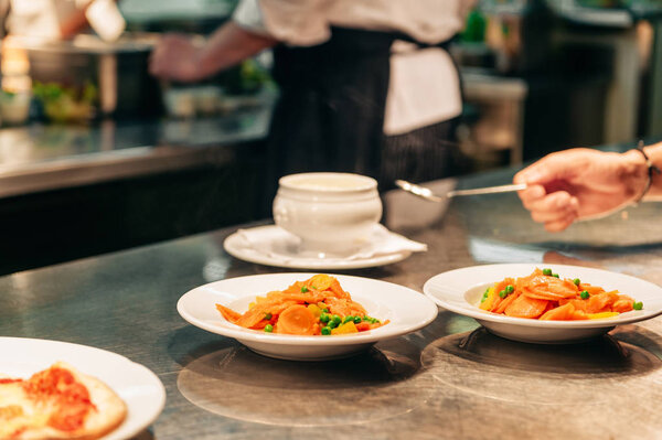 Food orders on the kitchen table in the restaurant