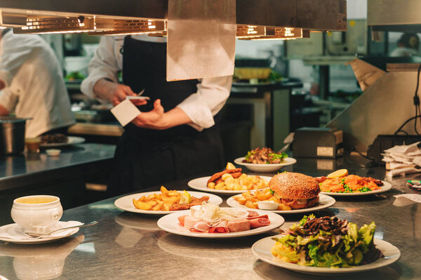 Food orders on the kitchen table in the restaurant