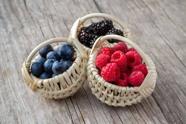 Ripe berries in small baskets — Stock Photo, Image