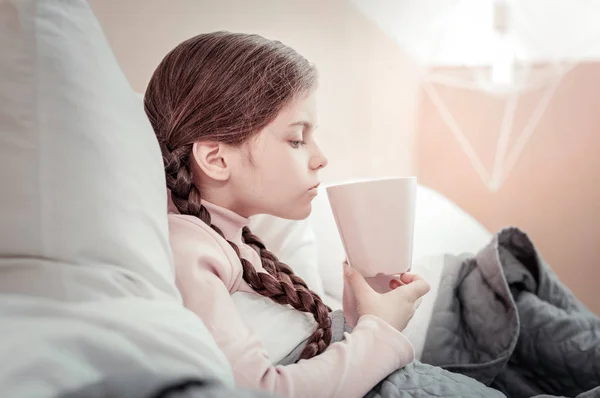 Careful kid drinking hot tea — Stock Photo, Image