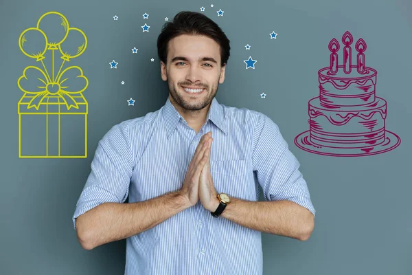 Happy man clapping while having a birthday party