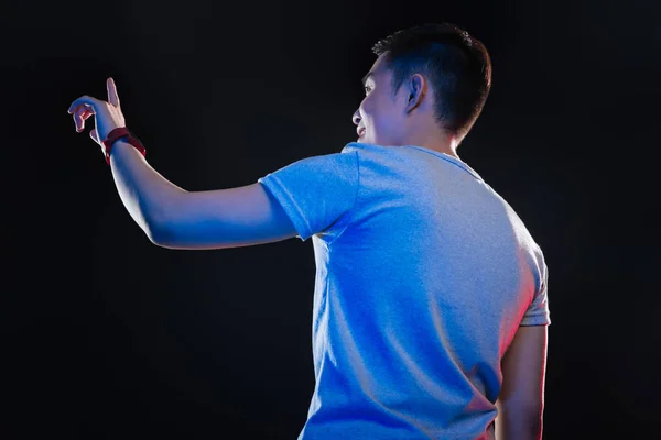 Cheerful happy teenager working on the transparent screen — Stock Photo, Image