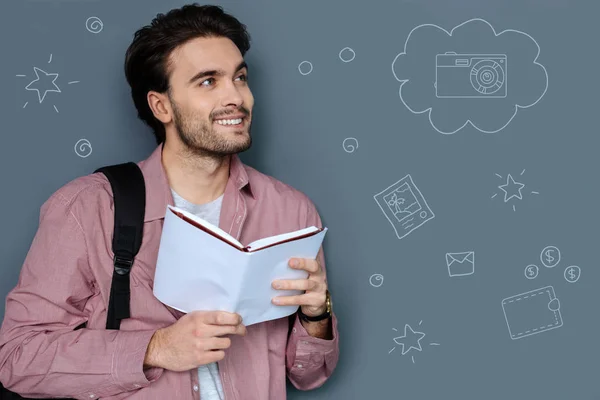 Young teacher dreaming about being rich and smiling — Stock Photo, Image