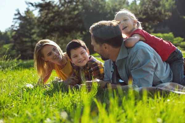 Content family relaxing together in the open air — Stock Photo, Image