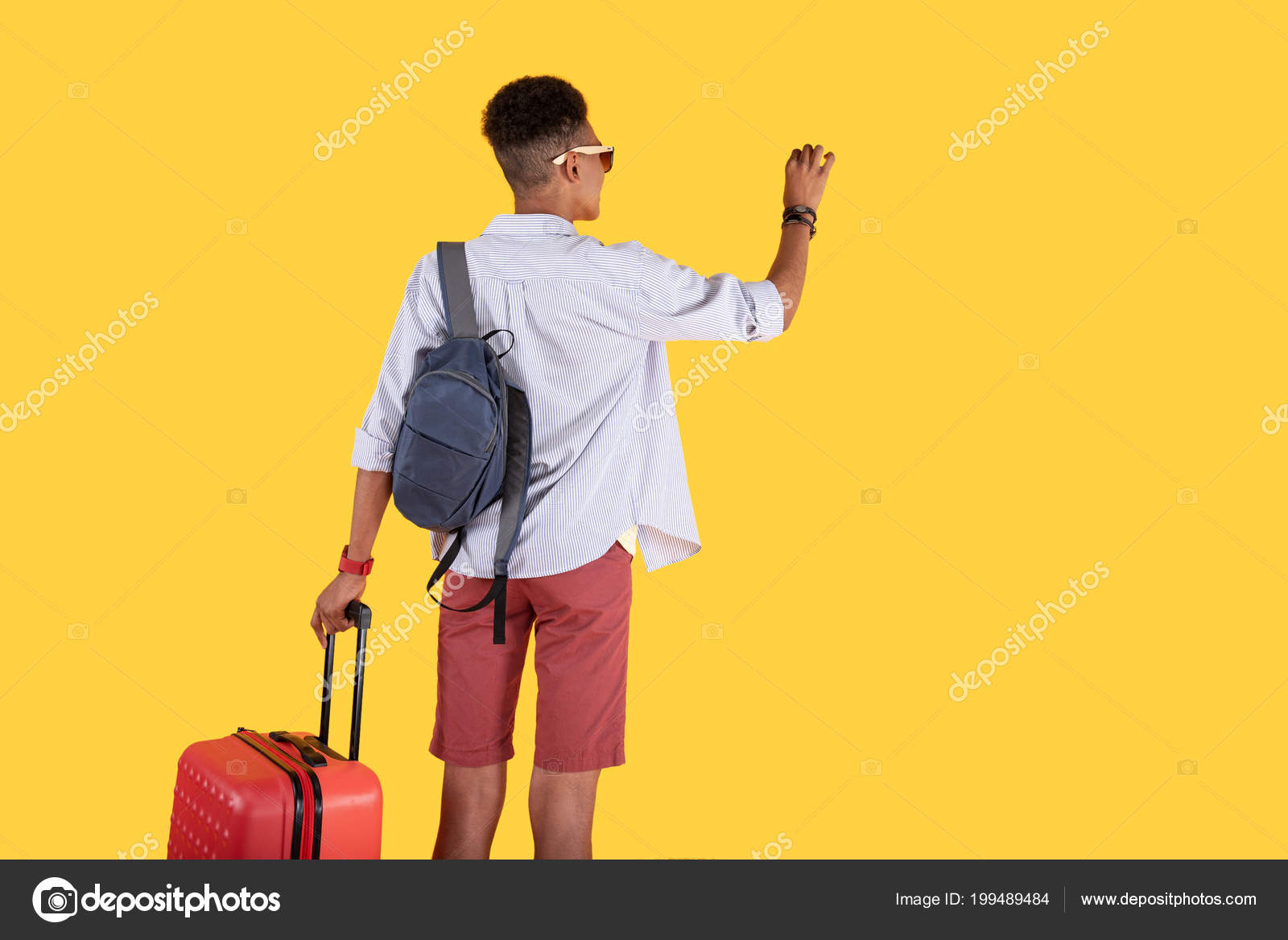 Joyful Positive Man Looking At The Front Door Stock Photo