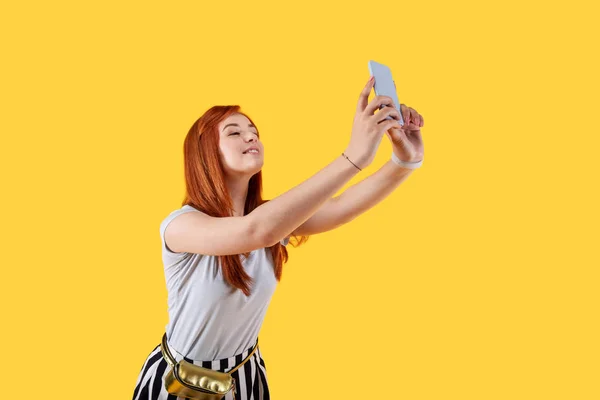 Attractive charming woman holding her smartphone — Stock Photo, Image