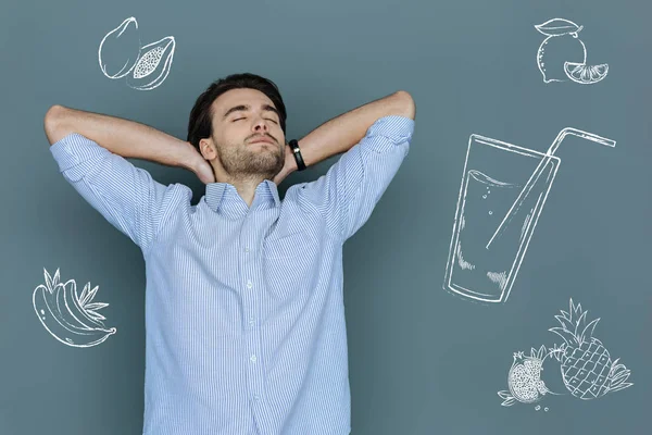 Handsome man taking a deep breath and clothing his eyes — Stock Photo, Image