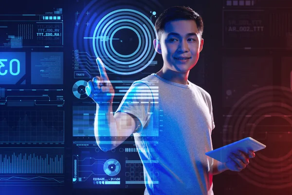 Cheerful web developer using holograms and enjoying his work — Stock Photo, Image