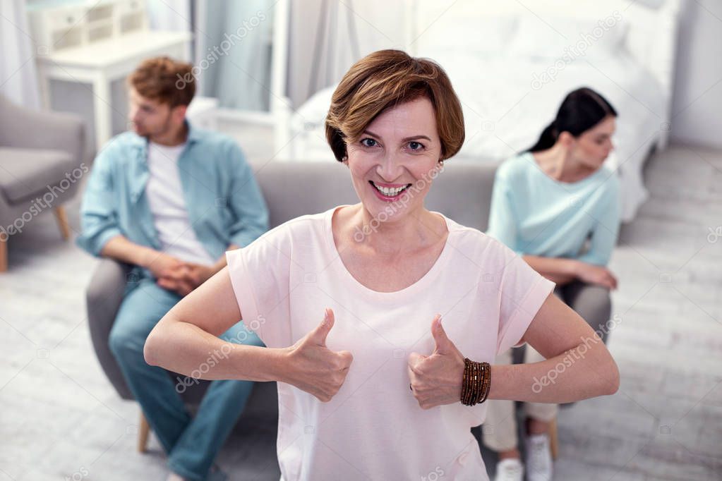 Happy nice woman showing Ok signs