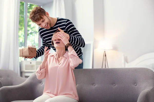 Happy nice man preparing a present — Stock Photo, Image