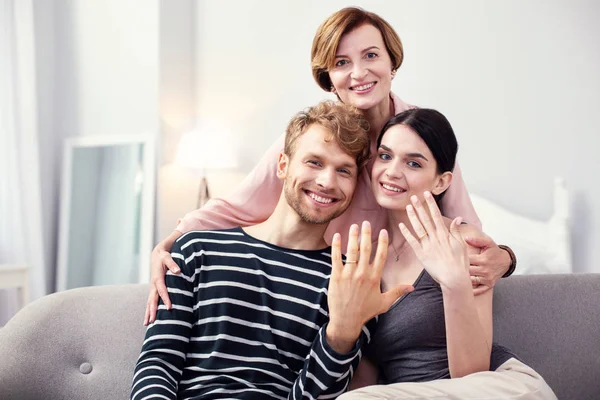 Nice aged woman hugging the couple — Stock Photo, Image