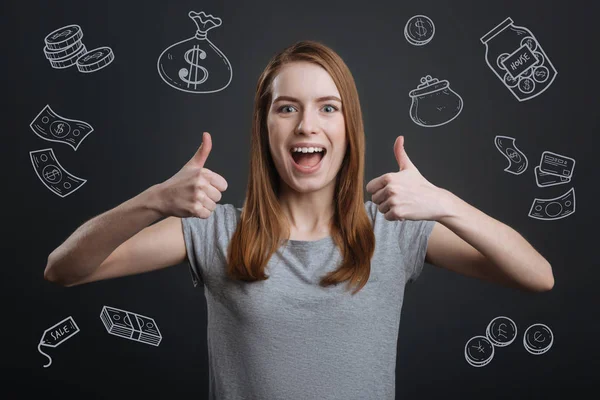 Excited person putting thumbs up after winning a lot of money — Stock Photo, Image