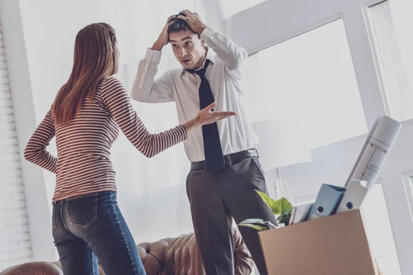 Unhappy young man holding his head — Stock Photo, Image