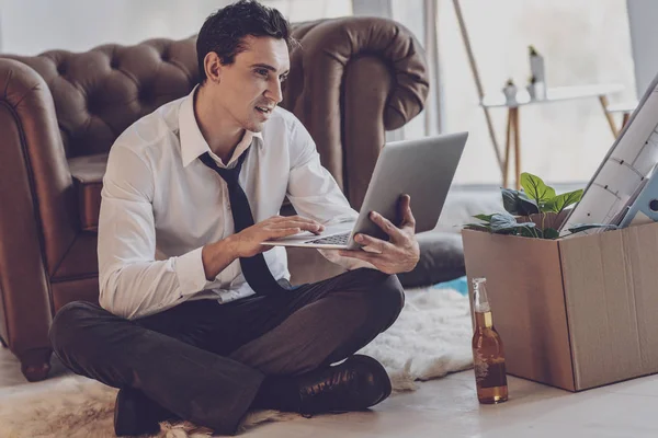 Cheerful delighted man sending his CV