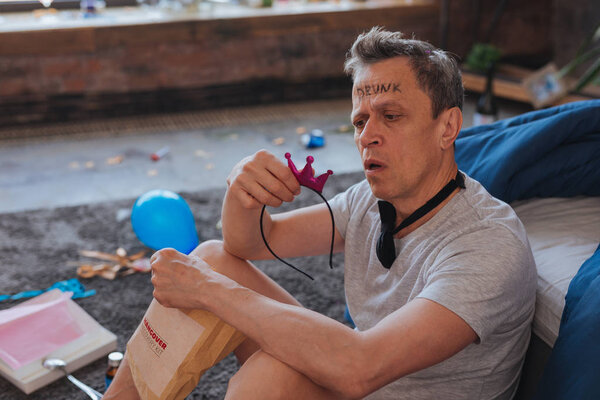 Amazed mature man recalling bachelor party