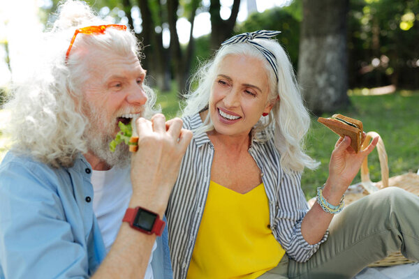 Happy nice couple eating