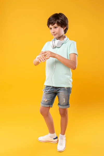 Meditative boy wearing a modern watch
