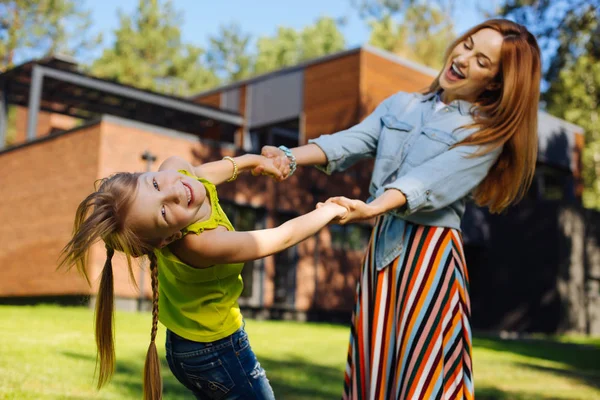 Exuberant girl spending time with her mummy — Stock Photo, Image