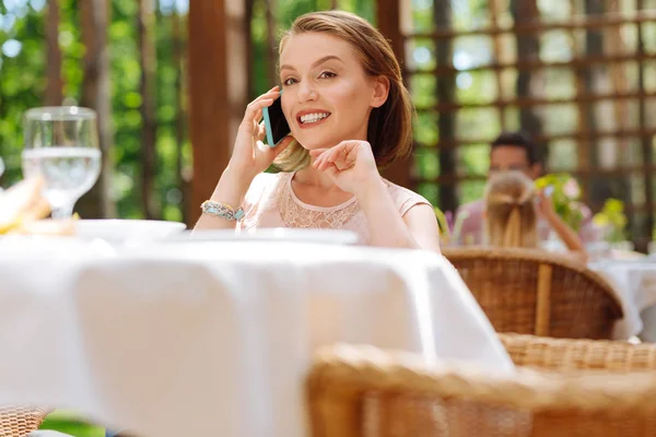 Prosperous businesswoman calling her partner — Stock Photo, Image