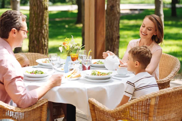 Little blonde-haired son having breakfast with parents — Stock Photo, Image
